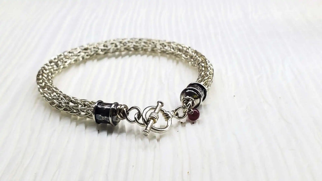 Handmade 10mm silver Viking knit bracelet with Ruby charm